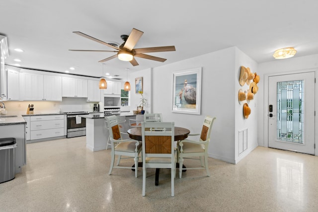 8045 W Lake Dr, Lake Clarke Shores, FL 33406 - dining area featuring ceiling fan, recessed lighting, baseboards, and dark speckled floor