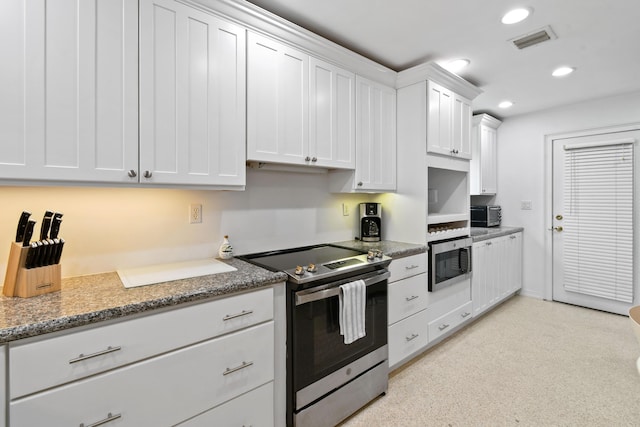 8045 W Lake Dr, Lake Clarke Shores, FL 33406 - kitchen featuring appliances with stainless steel finishes, white cabinets, recessed lighting, and stone countertops