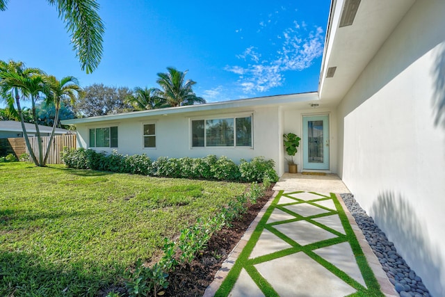 8045 W Lake Dr, Lake Clarke Shores, FL 33406 - doorway to property featuring stucco siding