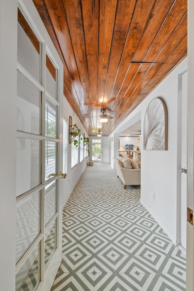 8045 W Lake Dr, Lake Clarke Shores, FL 33406 - corridor with wooden ceiling, carpet, and baseboards