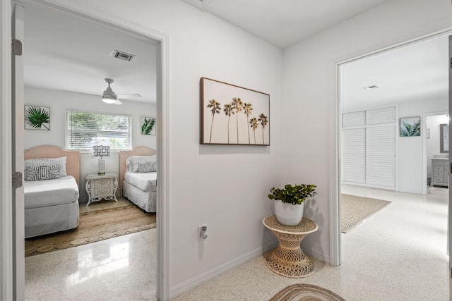 8045 W Lake Dr, Lake Clarke Shores, FL 33406 - hallway with speckle patterned floor and baseboards