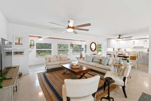 8045 W Lake Dr, Lake Clarke Shores, FL 33406 - living area with a ceiling fan and dark aggregate flooring