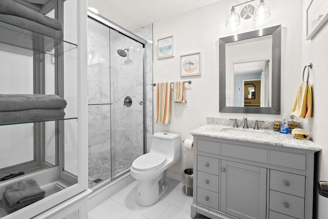 8045 W Lake Dr, Lake Clarke Shores, FL 33406 - full bathroom with a stall shower, toilet, vanity, and tile patterned flooring