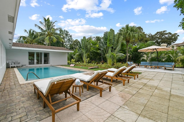 8045 W Lake Dr, Lake Clarke Shores, FL 33406 - outdoor pool with an outdoor hangout area and a patio area