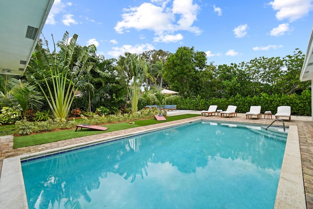 8045 W Lake Dr, Lake Clarke Shores, FL 33406 - view of swimming pool with a patio area