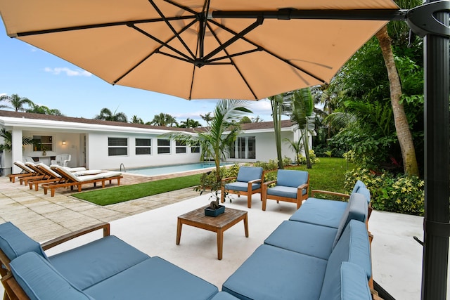 8045 W Lake Dr, Lake Clarke Shores, FL 33406 - view of patio featuring outdoor lounge area and an outdoor pool