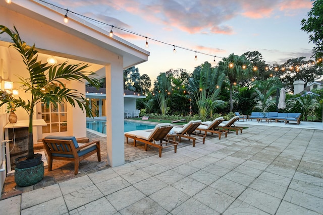 8045 W Lake Dr, Lake Clarke Shores, FL 33406 - view of patio / terrace featuring an outdoor living space and an outdoor pool