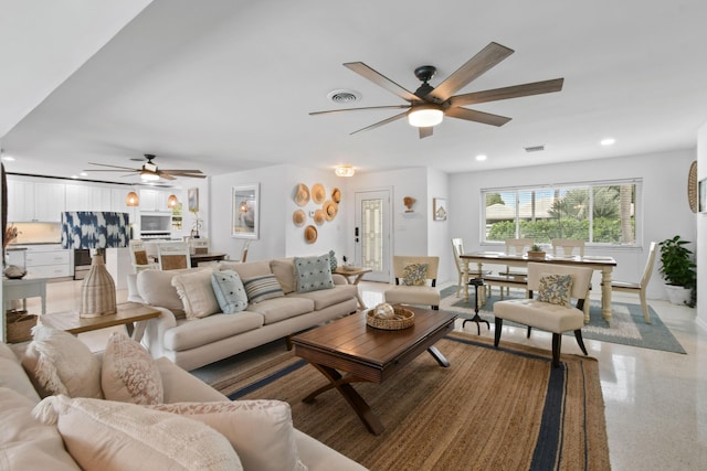 8045 W Lake Dr, Lake Clarke Shores, FL 33406 - living area featuring ceiling fan, recessed lighting, dark speckled floor, and baseboards