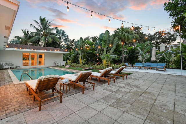 8045 W Lake Dr, Lake Clarke Shores, FL 33406 - swimming pool with an outdoor living space and a patio