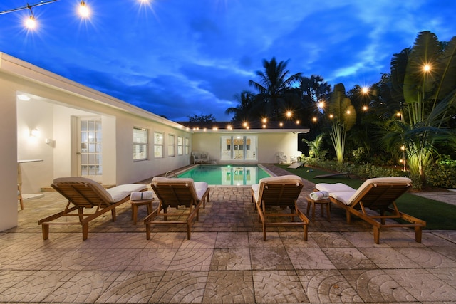 8045 W Lake Dr, Lake Clarke Shores, FL 33406 - swimming pool with a patio area and french doors