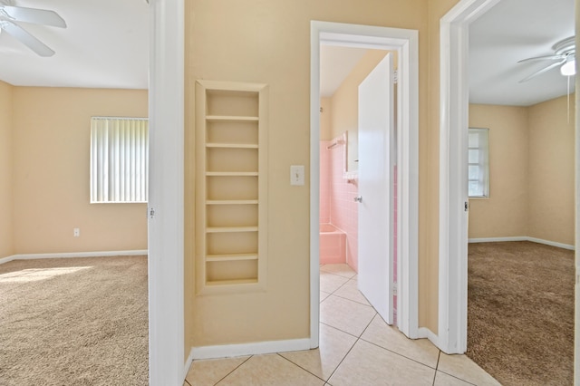 corridor with light colored carpet