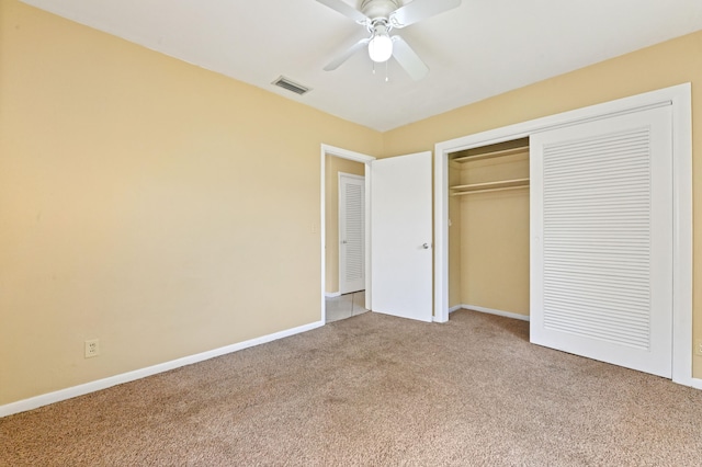 unfurnished bedroom with ceiling fan, a closet, and carpet floors