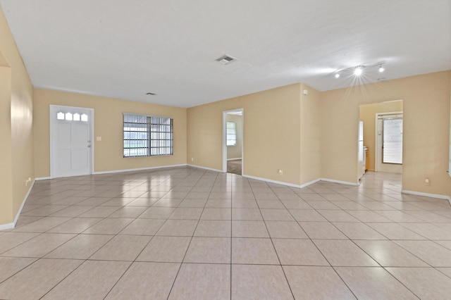 empty room featuring light tile patterned floors