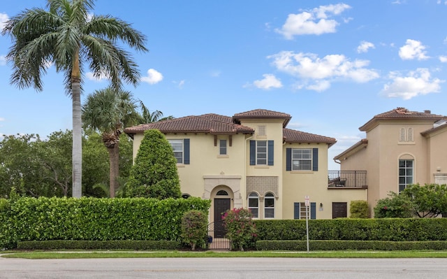 mediterranean / spanish-style home with a balcony