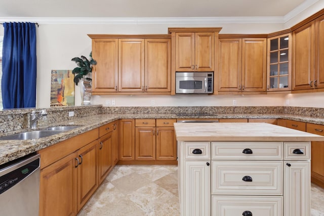 kitchen with stainless steel appliances, crown molding, wood counters, and sink