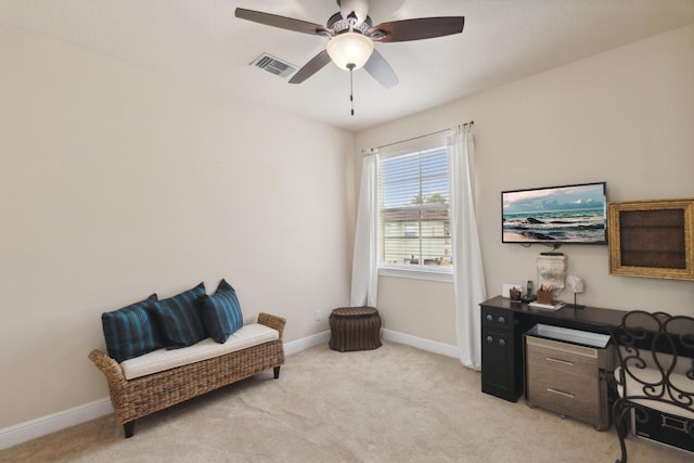 office space with ceiling fan and light colored carpet