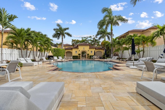 view of swimming pool with a patio