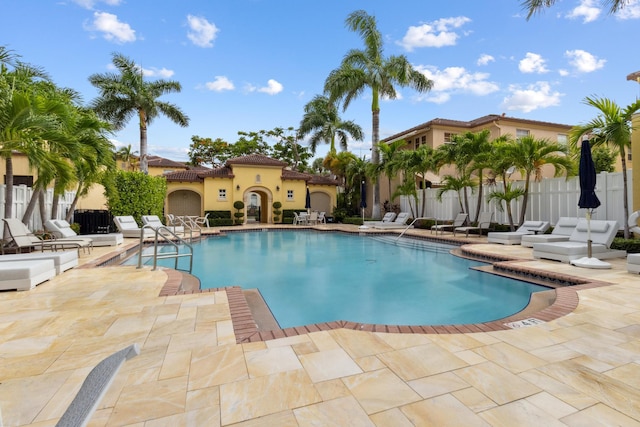 view of swimming pool featuring a patio area