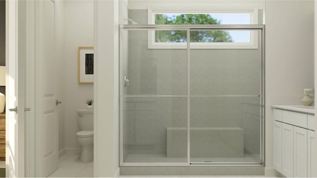 bathroom featuring vanity, toilet, a shower with door, and tile patterned floors