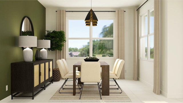 dining space featuring light tile patterned floors