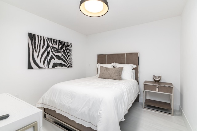 bedroom featuring baseboards