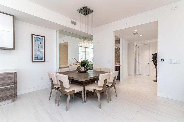 dining room featuring visible vents and baseboards