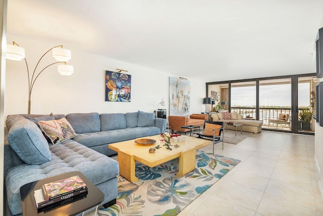 tiled living room featuring expansive windows