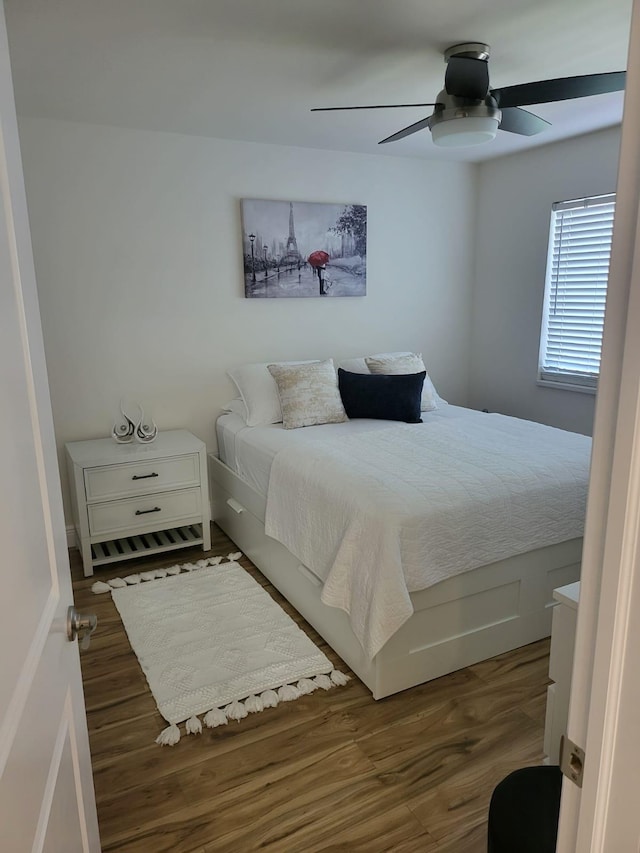 bedroom featuring dark wood-type flooring and ceiling fan