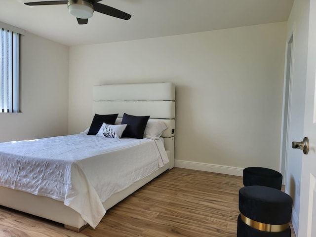 bedroom featuring wood-type flooring and ceiling fan