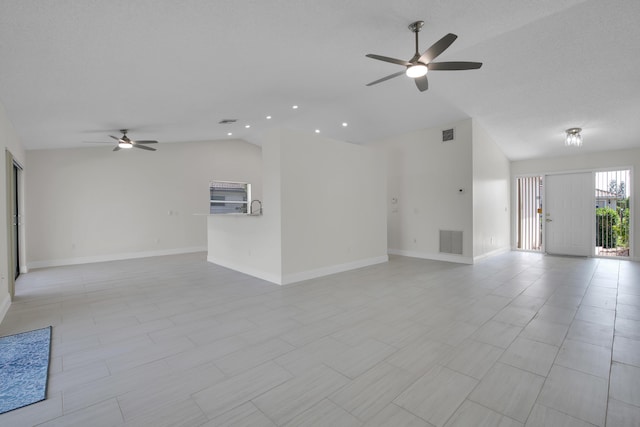 5625 Aspen Ridge Cir, Delray Beach, FL 33484 - unfurnished living room featuring ceiling fan, vaulted ceiling, baseboards, and recessed lighting