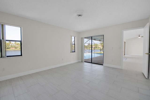 spare room with ceiling fan