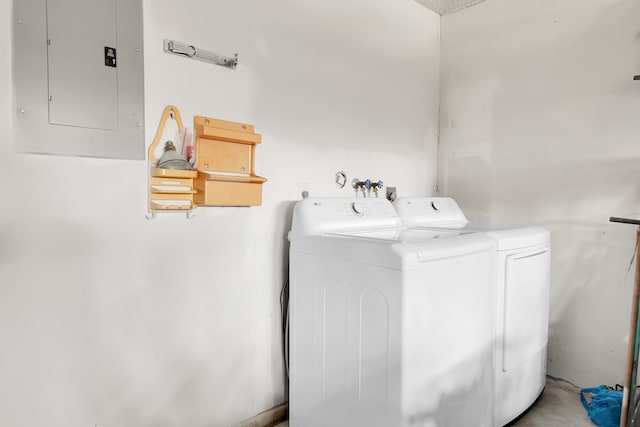 washroom with electric panel and washer and dryer