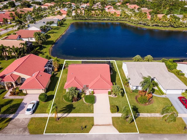 birds eye view of property with a residential view and a water view