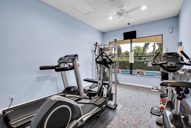 5625 Aspen Ridge Cir, Delray Beach, FL 33484 - exercise room featuring attic access, baseboards, a textured ceiling, a ceiling fan, and recessed lighting