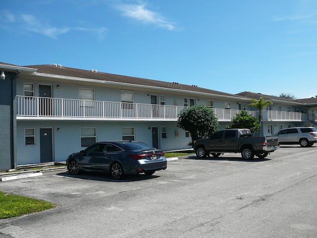 view of front of property with a balcony