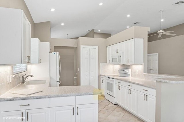 kitchen with white cabinets, white appliances, kitchen peninsula, ceiling fan, and sink