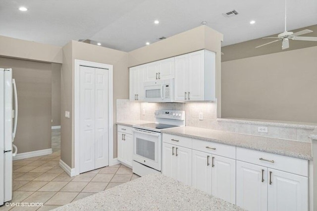 kitchen featuring decorative backsplash, white appliances, white cabinetry, and ceiling fan