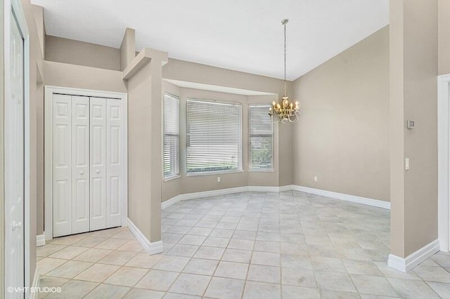 interior space with an inviting chandelier, lofted ceiling, and light tile patterned flooring