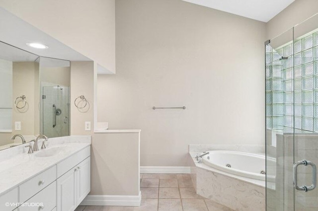 bathroom with vanity, shower with separate bathtub, and tile patterned floors