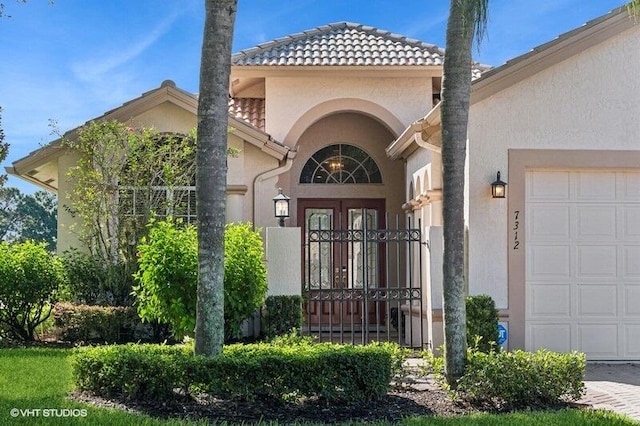 doorway to property featuring a garage