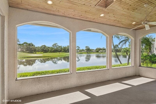 exterior space with wooden ceiling, a water view, vaulted ceiling, and ceiling fan