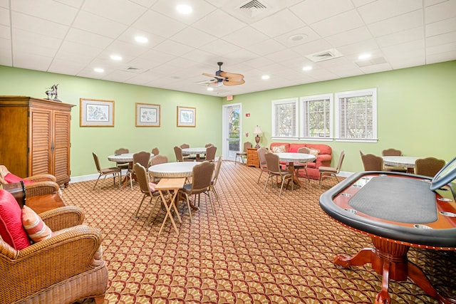 game room with ceiling fan and light colored carpet