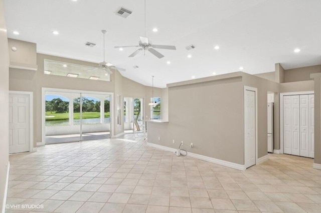 tiled spare room with high vaulted ceiling and ceiling fan