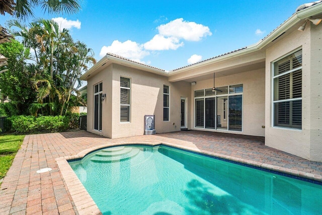 view of swimming pool with a patio area