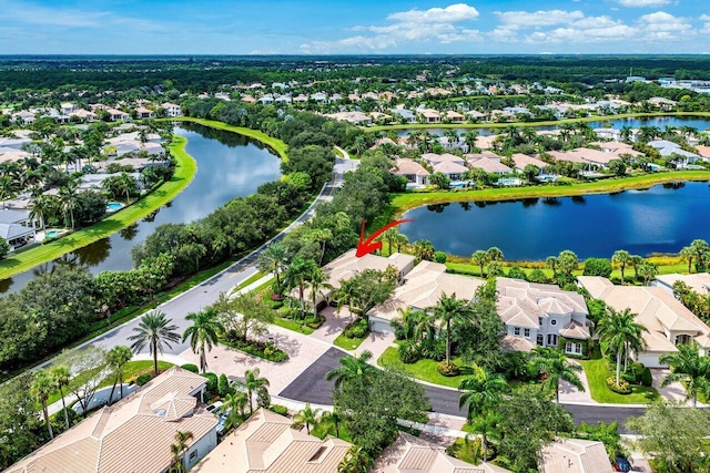 drone / aerial view with a water view