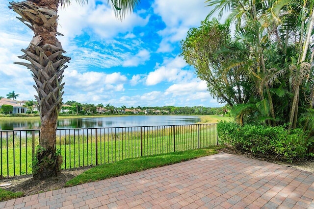 view of patio featuring a water view