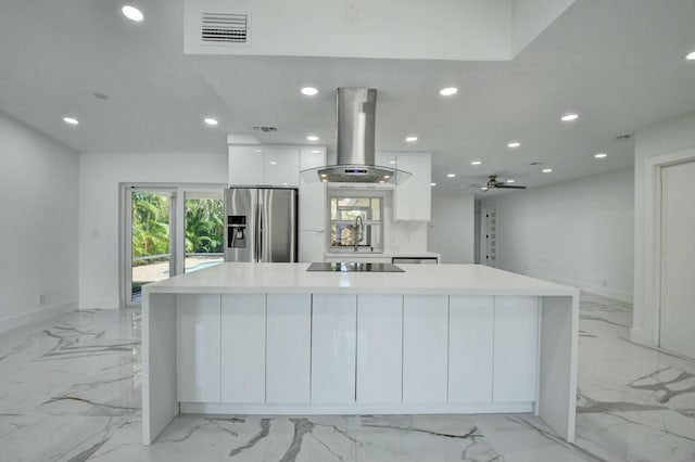 kitchen with a large island, black electric stovetop, white cabinets, island exhaust hood, and stainless steel fridge with ice dispenser