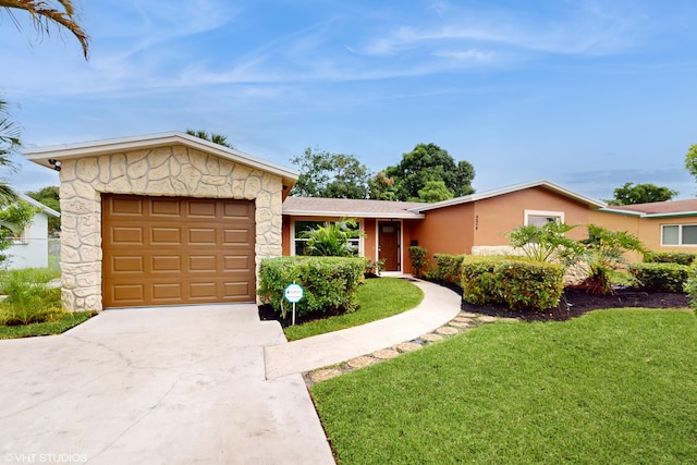 ranch-style home featuring a garage and a front yard