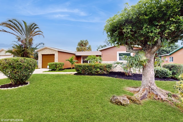 ranch-style home with a garage and a front yard