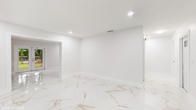 empty room featuring french doors